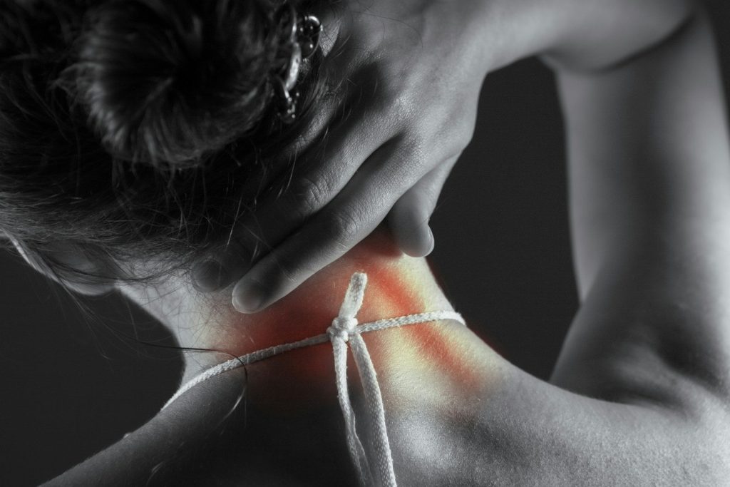 Woman's neck with highlighted pain area